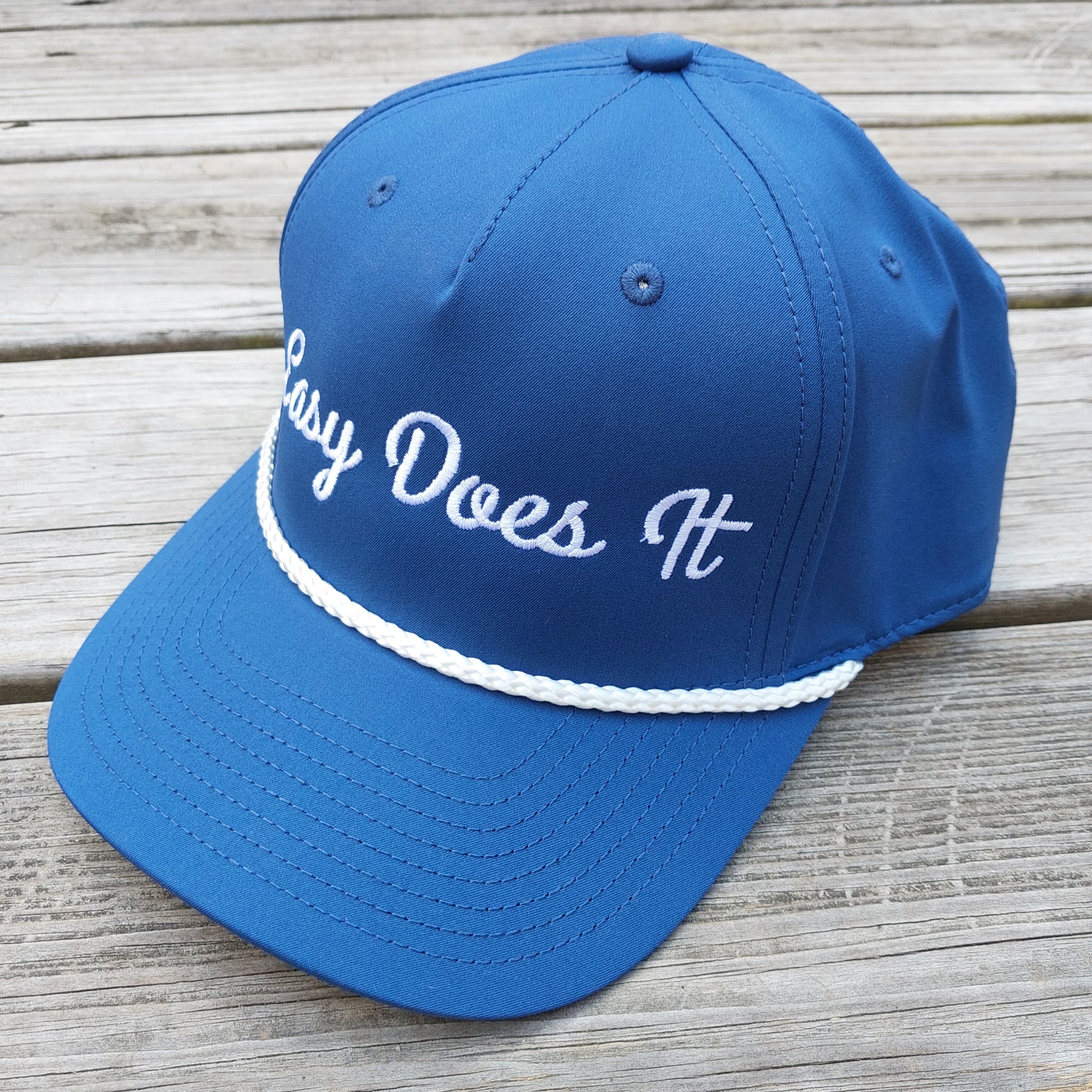 Easy Does It embroidered on a blue rope hat, angle view