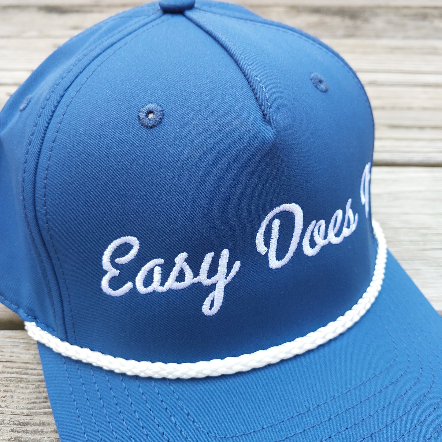 Easy Does It embroidered on a blue rope hat, detail vew