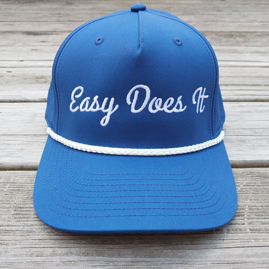 Easy Does It embroidered on a blue rope hat, front view