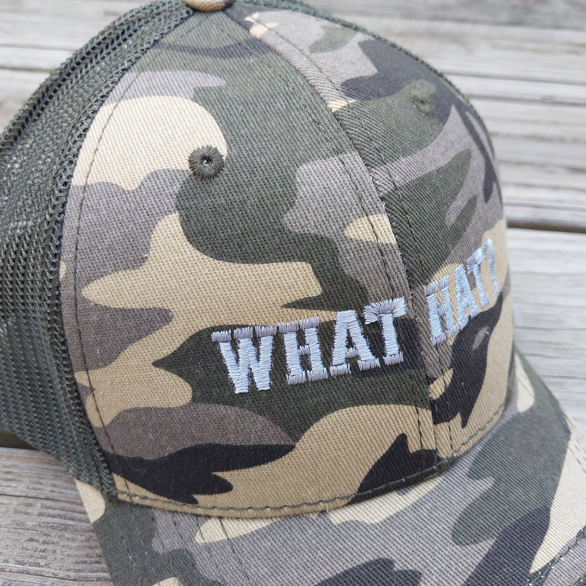What Hat? embroidered on camo mesh trucker hat, detail view